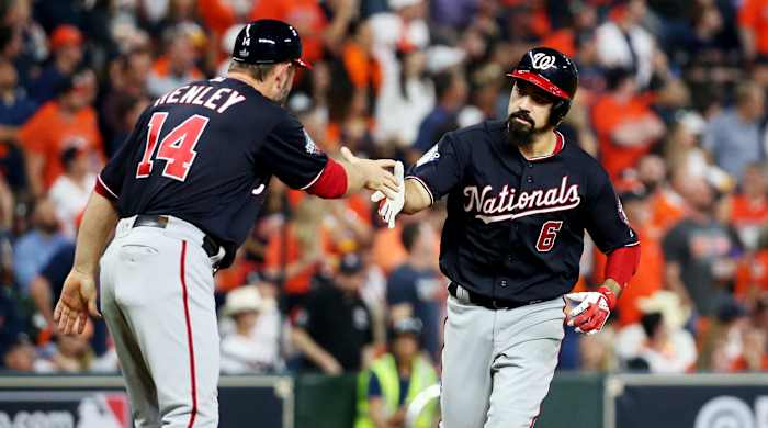 Oct 29, 2019; Houston, TX, USA; Washington Nationals third baseman Anthony Rendon (6) celebrates with third base coach Bob Henley (14) after hitting a two-run home run against the Houston Astros during the seventh inning in game six of the 2019 World Series at Minute Maid Park. Mandatory Credit: Troy Taormina-USA TODAY Sports